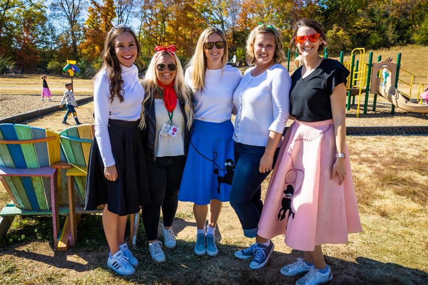 Teachers dressed in '50s wear smile